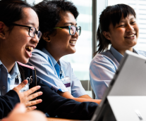 Three Students Smiling At Tablet Screen, Graphic